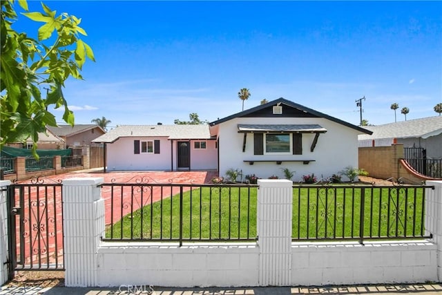 1132 Broadmoor Ave, La Puente, CA 91744 - view of front facade with stucco siding, a gate, and a fenced front yard
