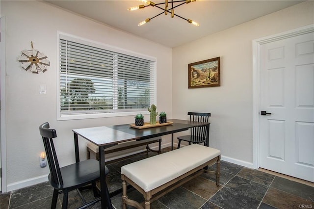 4574 Avenida Del Sol, Joshua Tree, CA 92252 - dining room with a chandelier and stone tile floors