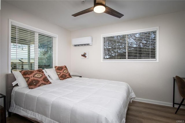 4574 Avenida Del Sol, Joshua Tree, CA 92252 - bedroom featuring a wall mounted AC, wood finished floors, and a ceiling fan