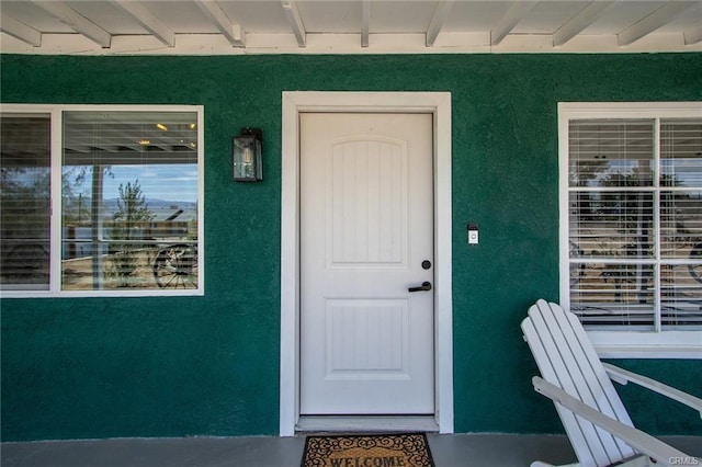 4574 Avenida Del Sol, Joshua Tree, CA 92252 - doorway to property featuring stucco siding