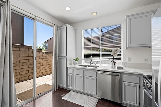 125 Draft Way, Placentia, CA 92870 - kitchen featuring appliances with stainless steel finishes, dark wood finished floors, light stone countertops, gray cabinets, and recessed lighting