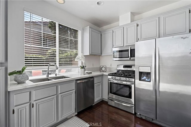 125 Draft Way, Placentia, CA 92870 - kitchen featuring appliances with stainless steel finishes, plenty of natural light, light countertops, and dark wood-style flooring