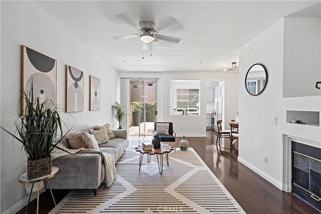 125 Draft Way, Placentia, CA 92870 - living area featuring dark wood-style floors, a ceiling fan, and a glass covered fireplace
