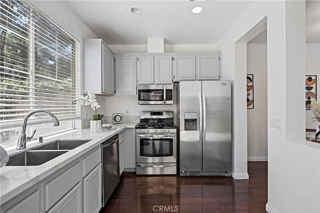 125 Draft Way, Placentia, CA 92870 - kitchen featuring stainless steel appliances, light stone counters, dark wood-style flooring, and recessed lighting