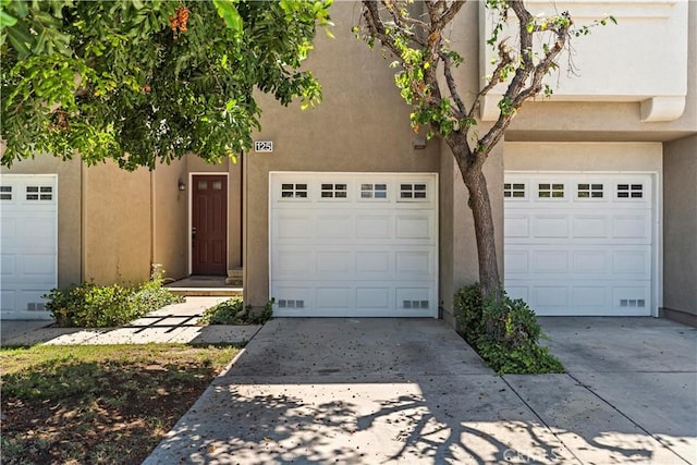 125 Draft Way, Placentia, CA 92870 - view of front facade with stucco siding, concrete driveway, and an attached garage
