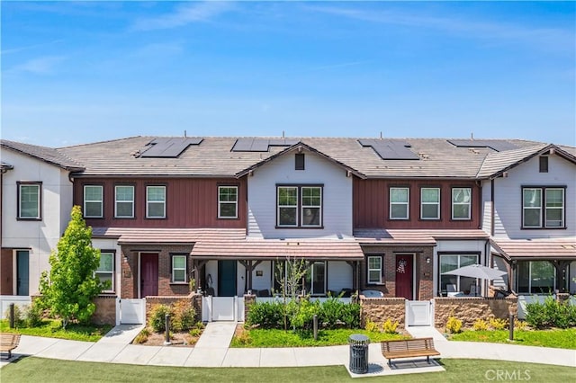 300 Farmhouse Dr Unit 3, Simi Valley, CA 93065 - view of property featuring a porch, a gate, and solar panels