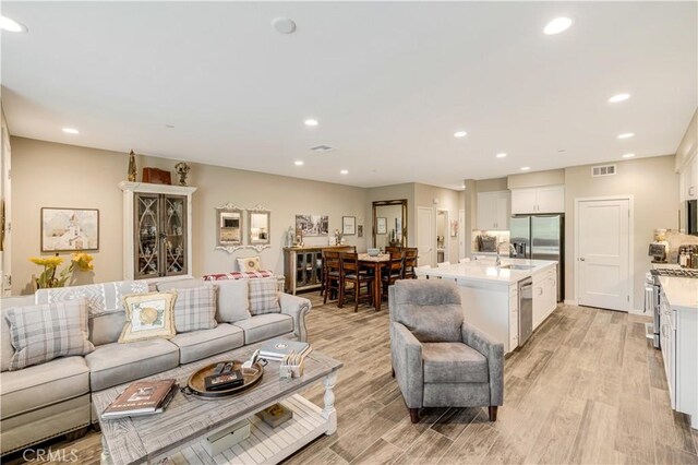 300 Farmhouse Dr Unit 3, Simi Valley, CA 93065 - living room featuring recessed lighting and light wood-type flooring