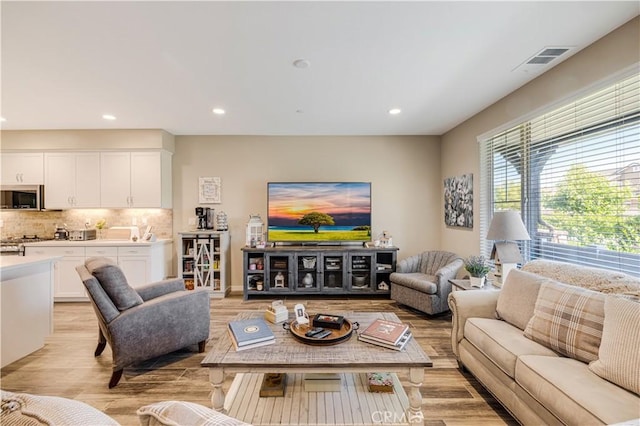300 Farmhouse Dr Unit 3, Simi Valley, CA 93065 - living room with light wood-type flooring and recessed lighting