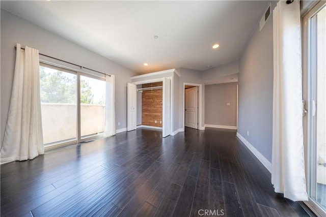 11253 Peach Grove St Unit 106, North Hollywood, CA 91601 - unfurnished bedroom featuring access to outside, dark wood-style flooring, recessed lighting, and a closet
