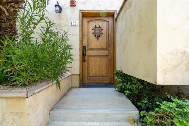 11253 Peach Grove St Unit 106, North Hollywood, CA 91601 - view of exterior entry featuring stucco siding