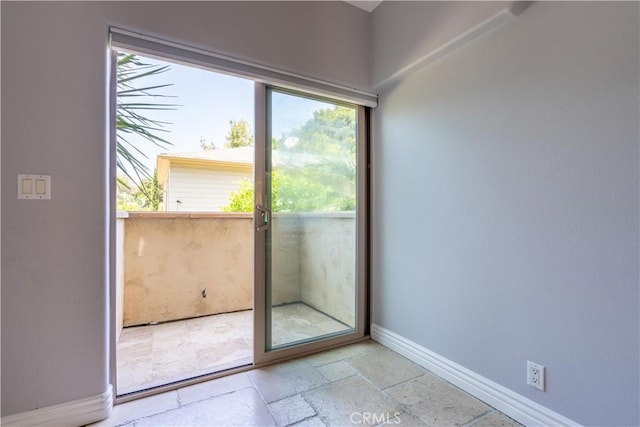 11253 Peach Grove St Unit 106, North Hollywood, CA 91601 - empty room with plenty of natural light and stone tile floors