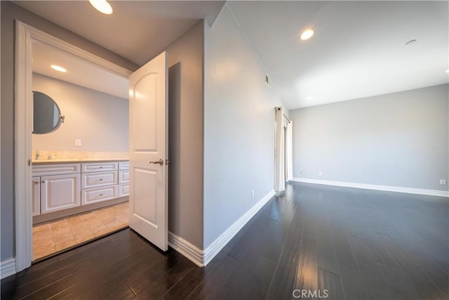 11253 Peach Grove St Unit 106, North Hollywood, CA 91601 - hallway featuring dark wood finished floors and recessed lighting
