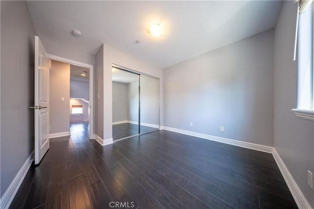 11253 Peach Grove St Unit 106, North Hollywood, CA 91601 - unfurnished bedroom with dark wood finished floors and a closet