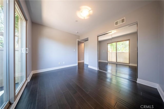 11253 Peach Grove St Unit 106, North Hollywood, CA 91601 - unfurnished room with dark wood-type flooring and baseboards