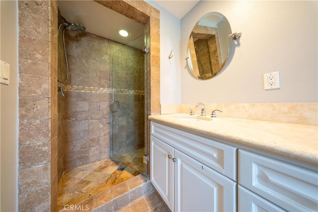 11253 Peach Grove St Unit 106, North Hollywood, CA 91601 - bathroom with vanity, a shower stall, and stone finish flooring