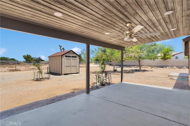 11969 Pinon Ave, Hesperia, CA 92345 - fenced backyard featuring a shed, a ceiling fan, and a patio area