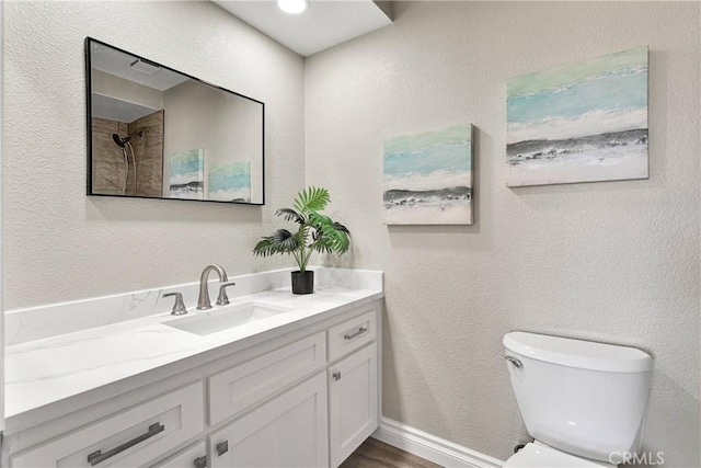 11969 Pinon Ave, Hesperia, CA 92345 - bathroom with vanity, wood finished floors, and a textured wall