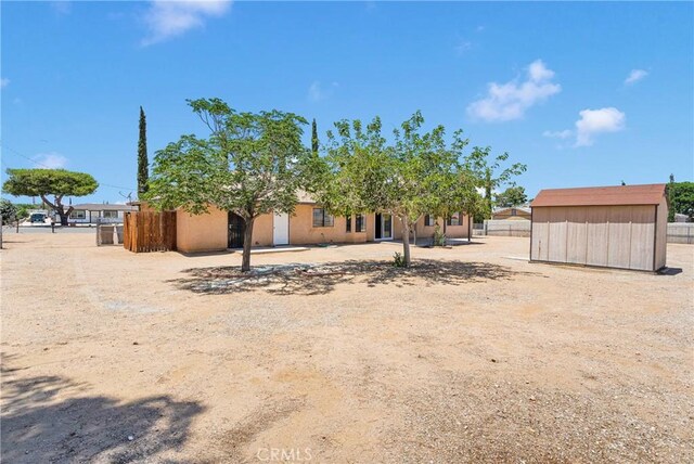 11969 Pinon Ave, Hesperia, CA 92345 - rear view of house featuring a shed