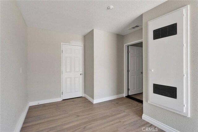 11969 Pinon Ave, Hesperia, CA 92345 - unfurnished room featuring wood finished floors and a pendent fire sprinkler