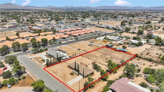 11969 Pinon Ave, Hesperia, CA 92345 - aerial view of property and surrounding area with property boundaries highlighted and a mountainous background