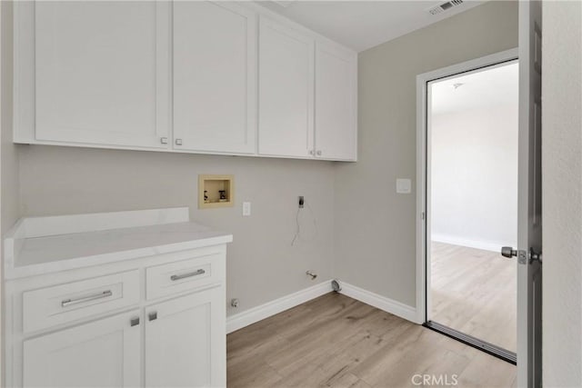 11969 Pinon Ave, Hesperia, CA 92345 - laundry room featuring hookup for an electric dryer, cabinet space, light wood finished floors, washer hookup, and gas dryer hookup