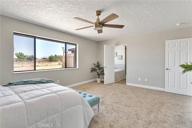 11969 Pinon Ave, Hesperia, CA 92345 - bedroom with carpet flooring, a textured ceiling, a ceiling fan, and connected bathroom