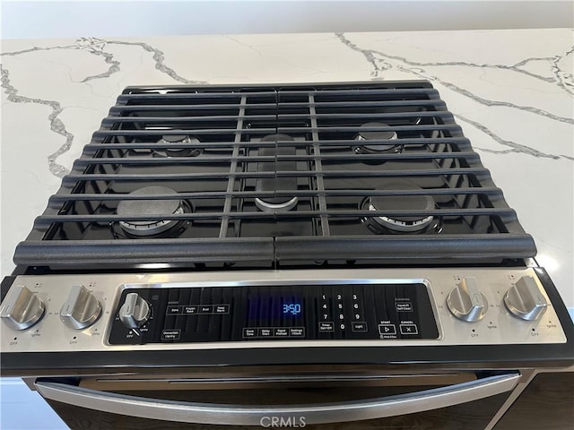 632 Truly Unit 634, Vista, CA 92084 - kitchen view of stainless steel gas stove and stone counters