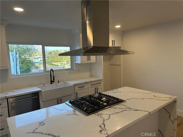 632 Truly Unit 634, Vista, CA 92084 - kitchen with island range hood, black gas stovetop, tasteful backsplash, light stone counters, and recessed lighting