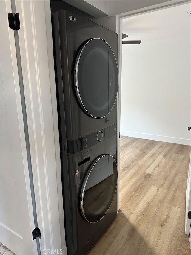 632 Truly Unit 634, Vista, CA 92084 - washroom with stacked washing machine and dryer, light wood-style flooring, and ceiling fan