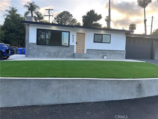 632 Truly Unit 634, Vista, CA 92084 - view of front of property with a lawn, stucco siding, and an attached garage