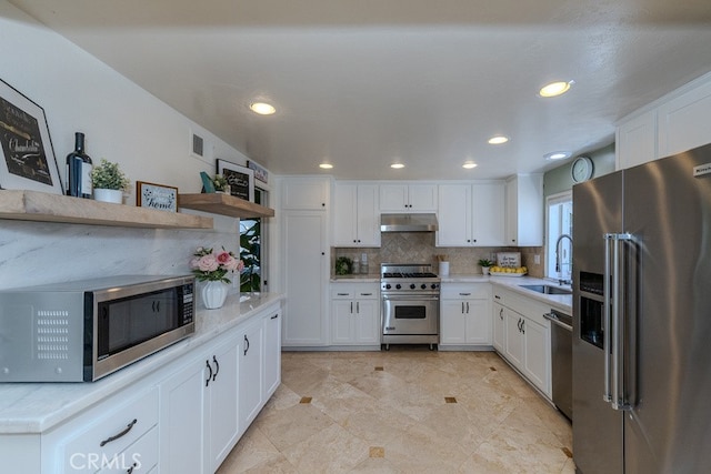 5035 Via Donaldo, Yorba Linda, CA 92886 - kitchen with high quality appliances, under cabinet range hood, white cabinets, tasteful backsplash, and recessed lighting