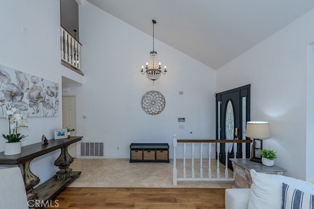5035 Via Donaldo, Yorba Linda, CA 92886 - entryway featuring high vaulted ceiling, a chandelier, and wood finished floors