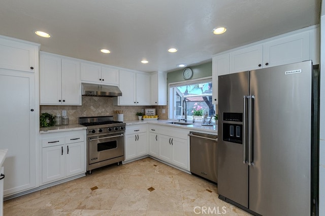 5035 Via Donaldo, Yorba Linda, CA 92886 - kitchen with high quality appliances, under cabinet range hood, white cabinetry, and recessed lighting