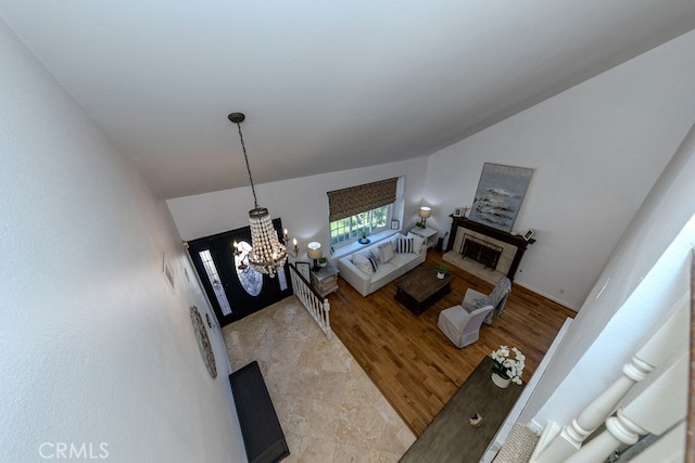 5035 Via Donaldo, Yorba Linda, CA 92886 - living area with a chandelier, a fireplace, and light wood-style flooring