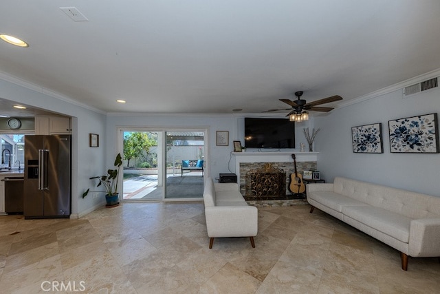 5035 Via Donaldo, Yorba Linda, CA 92886 - living room featuring ornamental molding, a ceiling fan, a stone fireplace, and recessed lighting