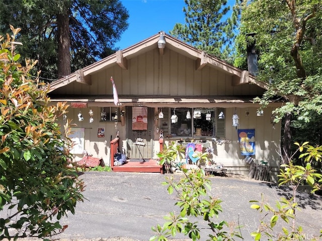 22726 Ponderosa Dr, Crestline, CA 92325 - back of house with a porch