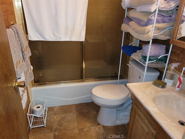 22726 Ponderosa Dr, Crestline, CA 92325 - full bathroom with bath / shower combo with glass door, vanity, and stone finish floors
