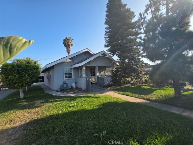 3424 E Cesar E Chavez Ave, Los Angeles, CA 90063 - view of front facade with stucco siding and a front yard