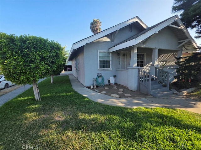 3424 E Cesar E Chavez Ave, Los Angeles, CA 90063 - bungalow-style house with stucco siding, a front lawn, and covered porch