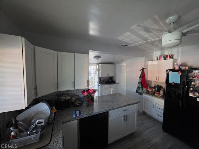 3424 E Cesar E Chavez Ave, Los Angeles, CA 90063 - kitchen featuring black appliances, white cabinets, backsplash, light stone countertops, and wood finished floors