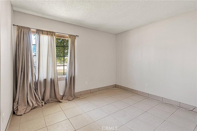 13491 Solitude Cir, Victorville, CA 92392 - empty room with light tile patterned floors and a textured ceiling