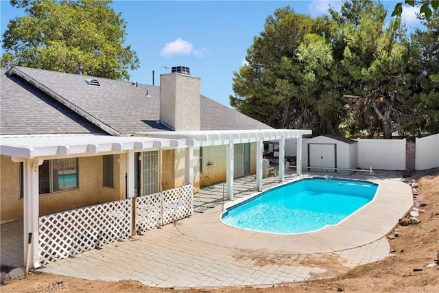 13491 Solitude Cir, Victorville, CA 92392 - view of pool featuring a patio and a storage unit