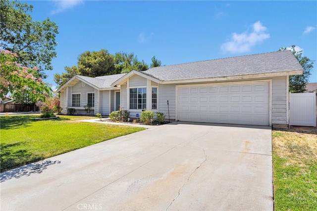 13491 Solitude Cir, Victorville, CA 92392 - ranch-style house with a garage and driveway