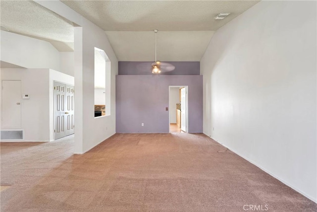 13491 Solitude Cir, Victorville, CA 92392 - unfurnished room with light carpet, a ceiling fan, high vaulted ceiling, and a textured ceiling