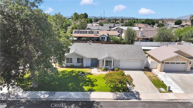 13491 Solitude Cir, Victorville, CA 92392 - view of front of property featuring a residential view, concrete driveway, and an attached garage