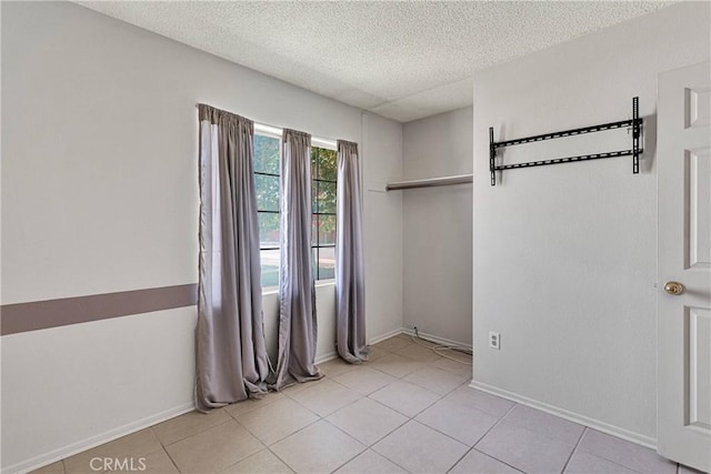 13491 Solitude Cir, Victorville, CA 92392 - unfurnished bedroom with a textured ceiling and light tile patterned floors