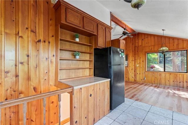 22490 Rockwell Rd, Cedarpines Park, CA 92322 - kitchen featuring freestanding refrigerator, wooden walls, vaulted ceiling, ceiling fan, and light tile patterned floors