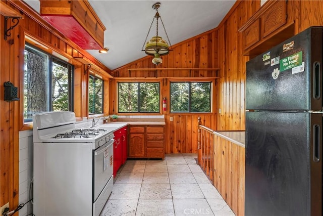 22490 Rockwell Rd, Cedarpines Park, CA 92322 - kitchen featuring freestanding refrigerator, white range with gas cooktop, vaulted ceiling, healthy amount of natural light, and light countertops