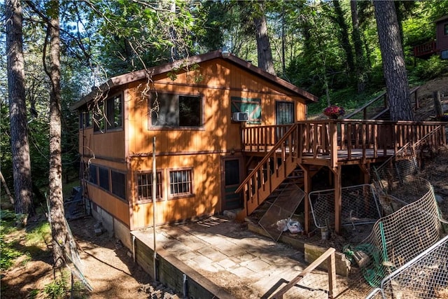 22490 Rockwell Rd, Cedarpines Park, CA 92322 - rear view of house featuring a deck, stairway, a patio, and crawl space