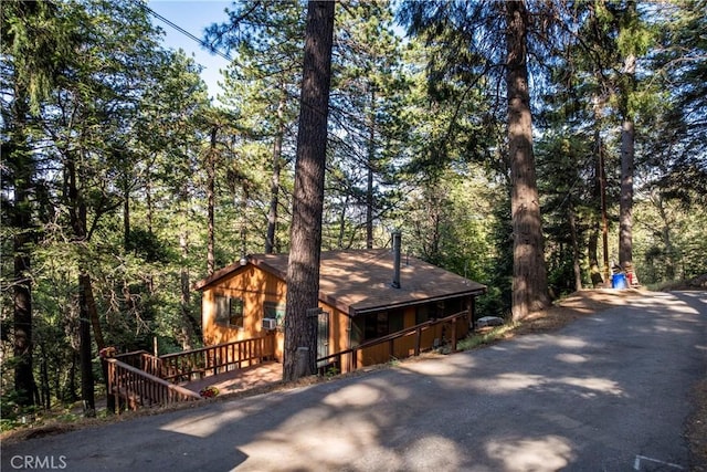 22490 Rockwell Rd, Cedarpines Park, CA 92322 - chalet / cabin with driveway and a view of trees